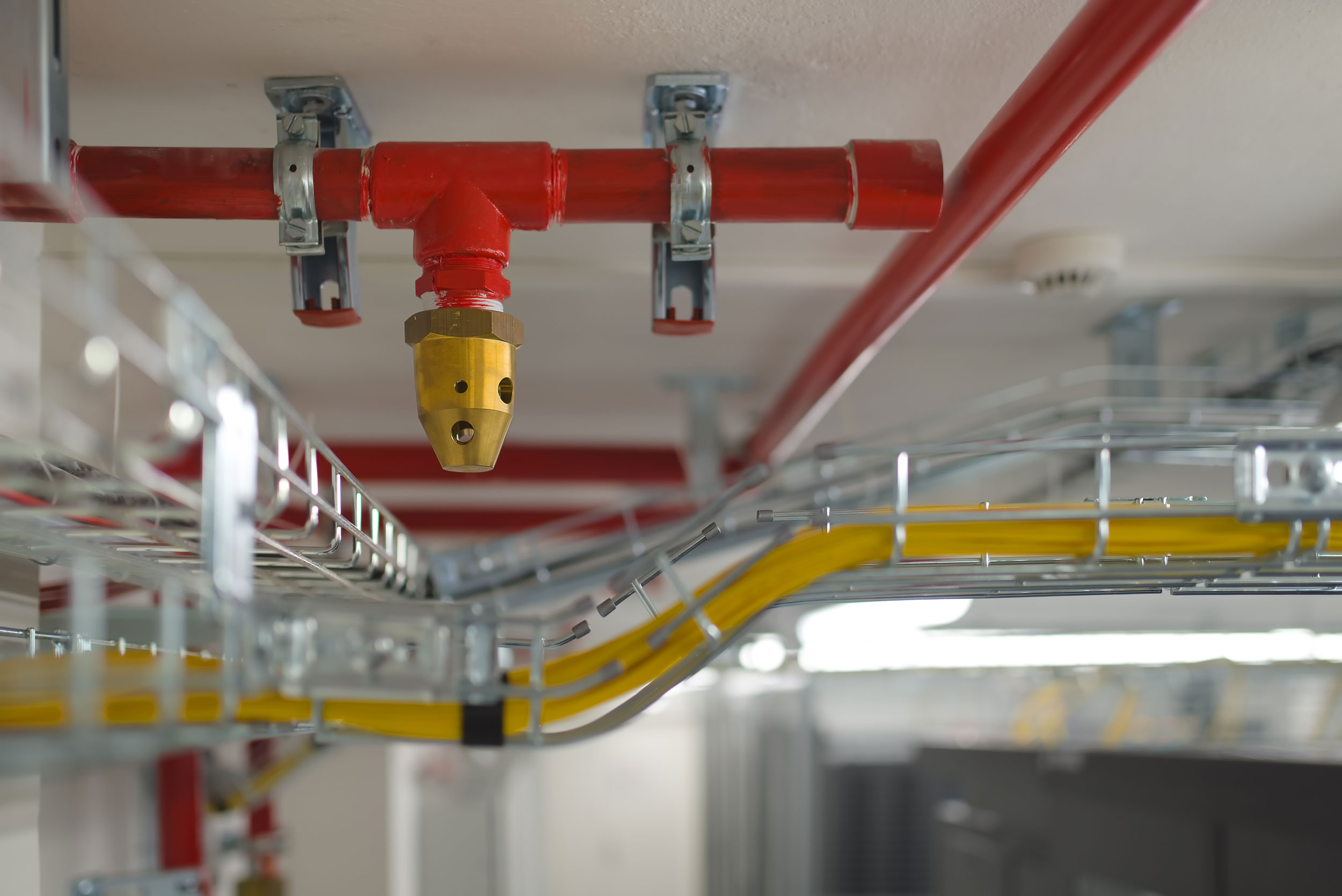 Clean agent suppression nozzle on red fire protection piping in a commercial facility in Southeast Missouri